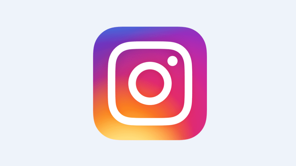 Instagram logo: A white camera outline inside a rounded square with a vibrant pink, purple, orange, and yellow gradient background.