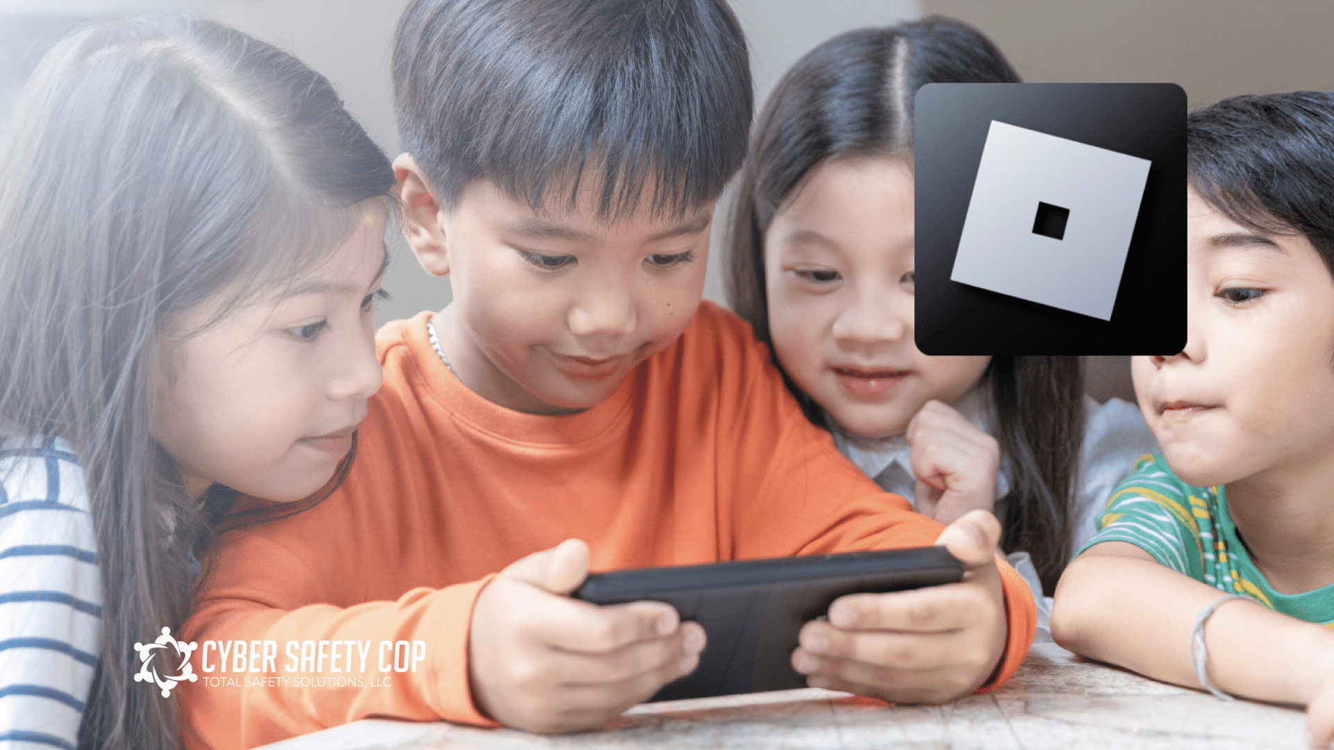 Four children sit closely together, smiling and looking at a tablet. The Roblox logo is visible in the top right corner. In the bottom left, the Cyber Safety Cop logo and text are displayed.