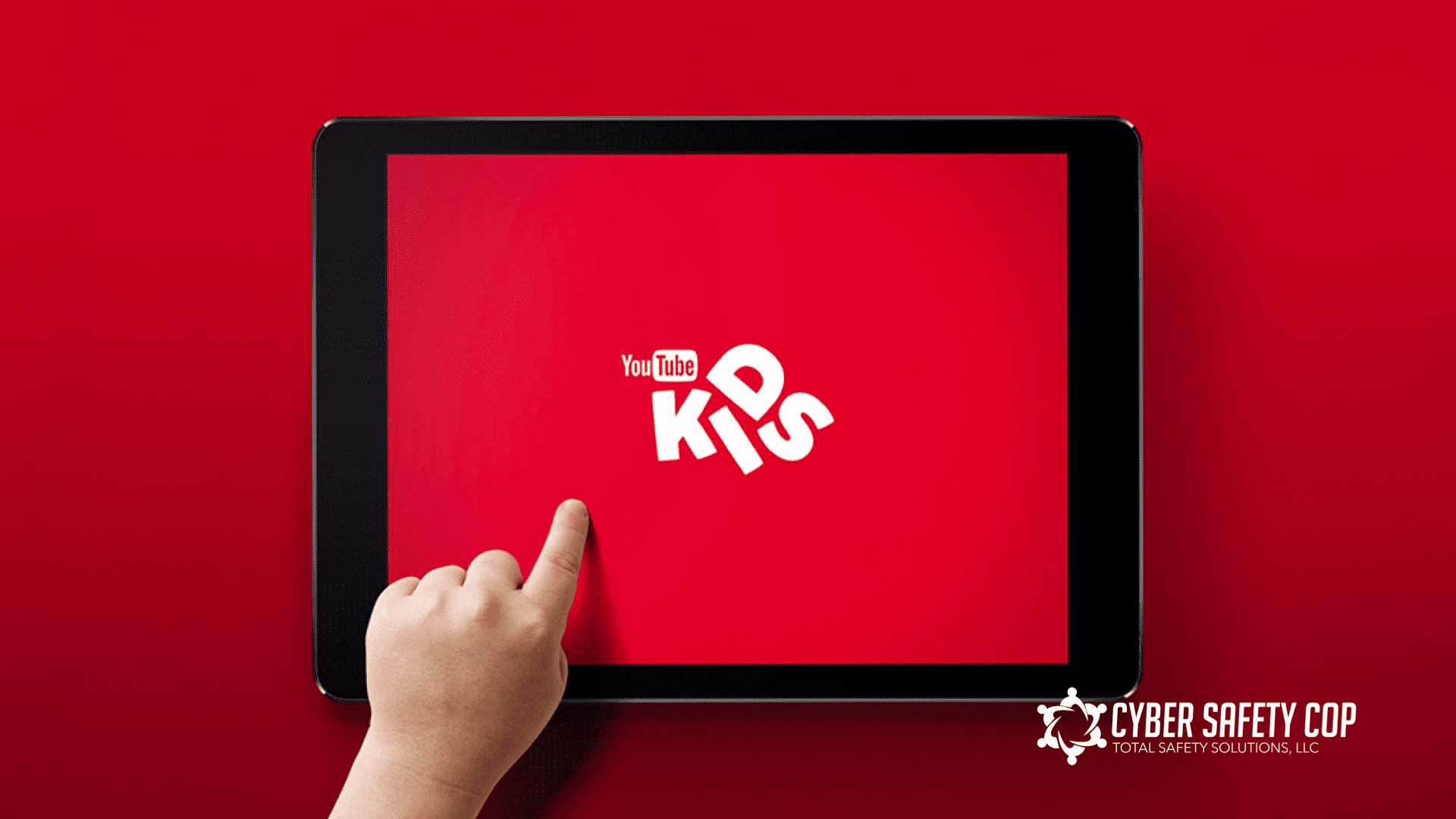 A hand touching a tablet.
