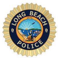 Gold badge featuring the words “Long Beach Police” and a colorful central seal with a sunrise, a woman, a ship, and coastal scenery.