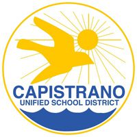 A circular logo with a yellow bird flying in front of a sun with rays. Below the bird are blue waves, with the words "Capistrano Unified School District" written in blue text.