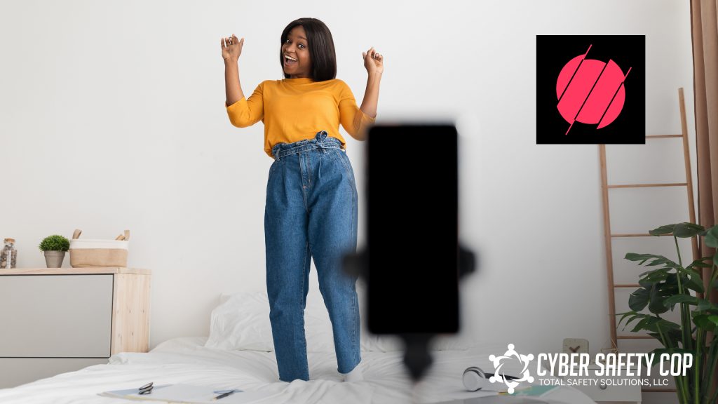 A woman stands on a bed, smiling with raised arms, as a smartphone records her Triller music video creation. The Cyber Safety Cop logo and an app icon are visible in the bright, modern bedroom setting.