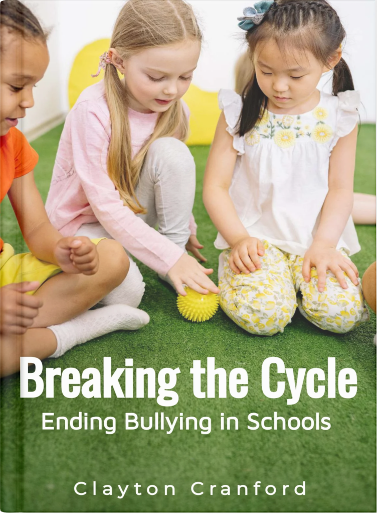 Three young girls sit on a green carpet, playing together with a yellow spiky ball and appearing engaged and friendly. The book cover reads "Breaking the Cycle: Ending Bullying in Schools"—an eBook available to Premium Members.