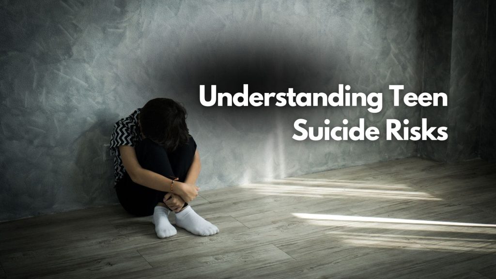 A sad teenager sits alone on the floor with knees drawn up and head down against a gray wall. Sunlight casts shadows nearby. Text reads, “Understanding Teen Suicide Risks: A Parents Guide in the Digital Age.”.