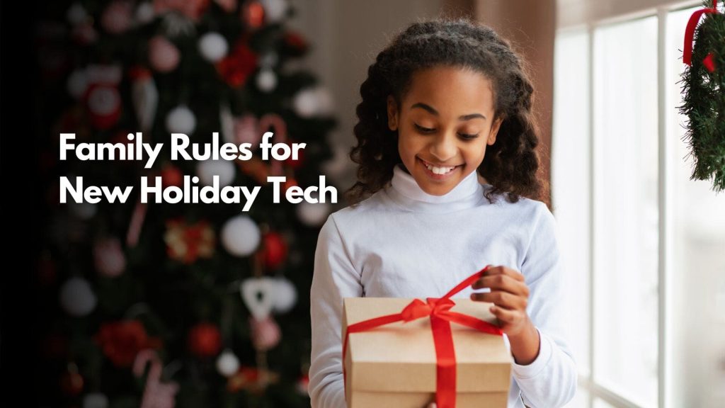 A smiling girl opens a gift with a red ribbon in front of a decorated Christmas tree. Text reads: "Family Rules for Healthy Tech Use This Holiday Season.