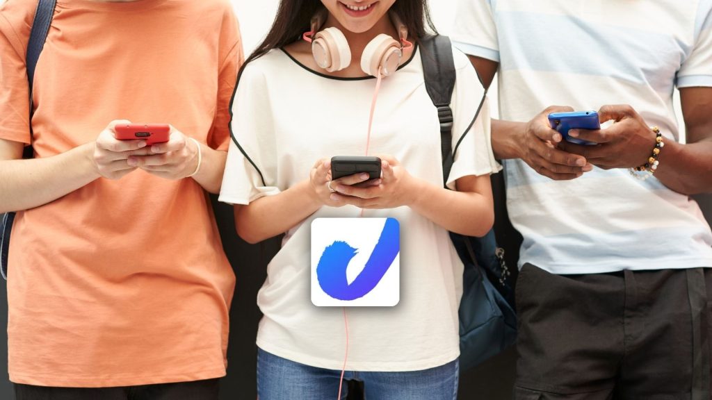 A woman holding a phone, exploring The Jump app to learn more about cyber internet safety.